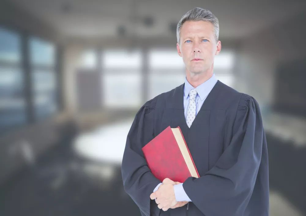 judge-holding-book-front-office