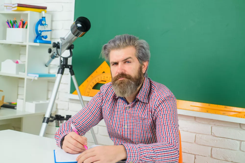 serious-teacher-classroom-learning-education-school-concept-september-teacher-prepares-lessons