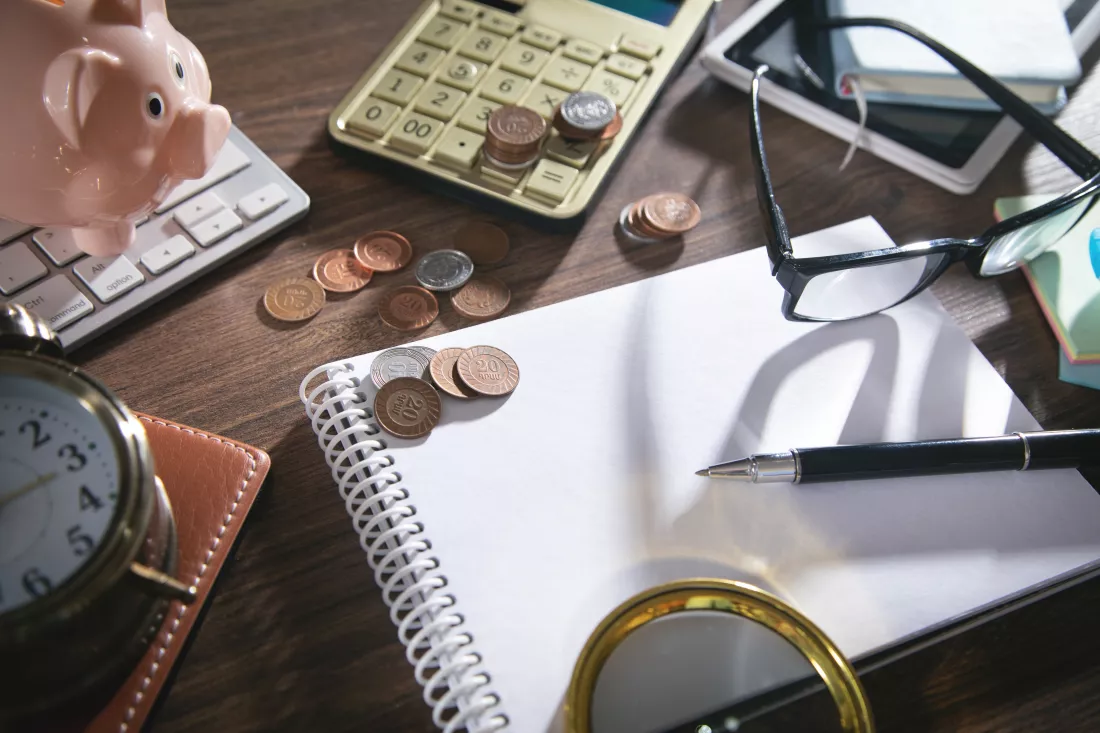 coins-calculator-piggy-bank-other-objects-business-desk
