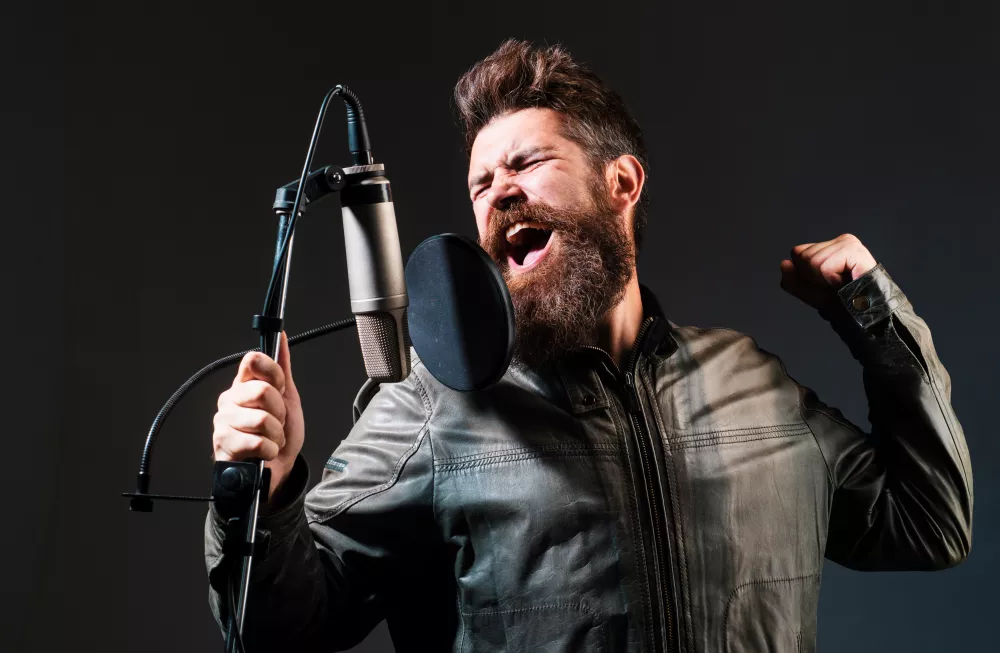 man-with-microphone-singing-song-musician-music-hall-expressive-singer-with-microphone-funny-guy