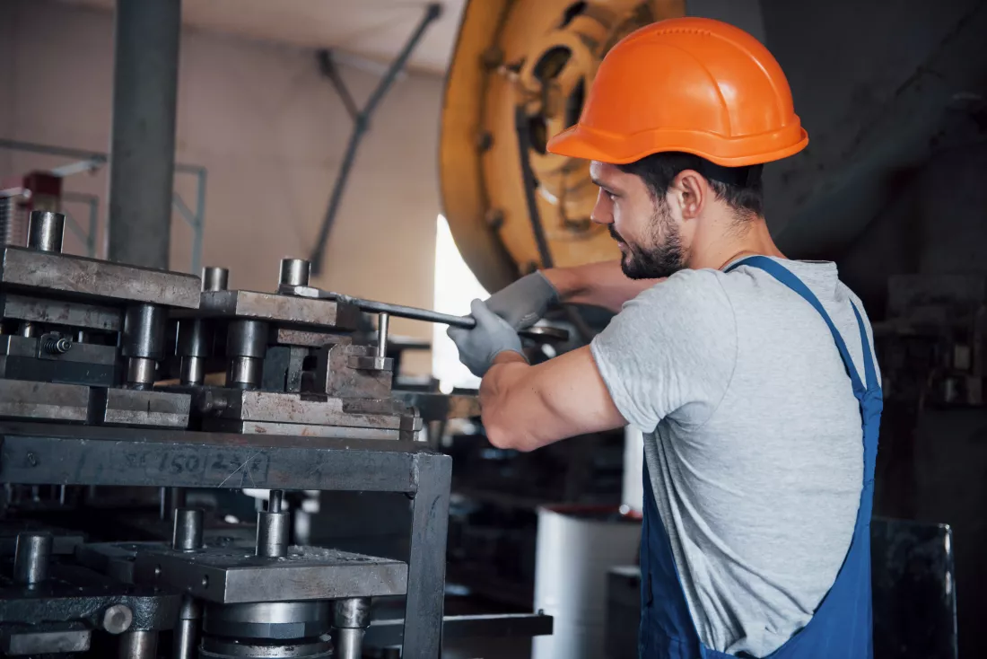 portrait-young-worker-hard-hat-large-metalworking-plant