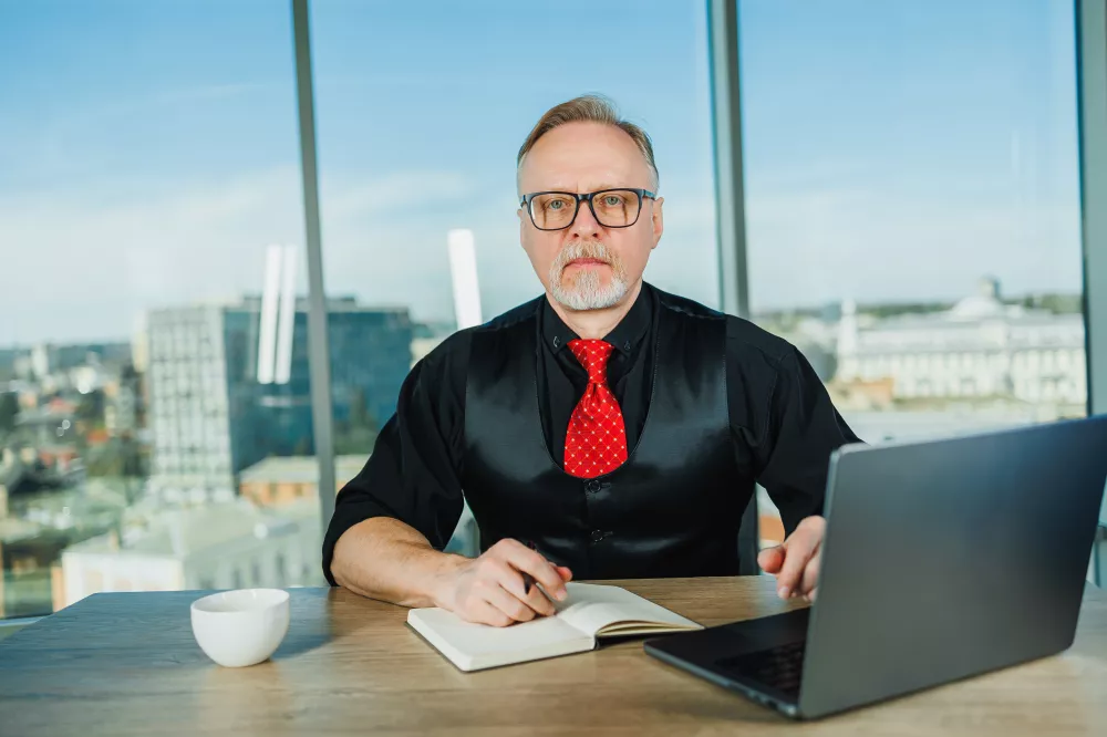 adult-gray-boss-sitting-office-workplace-old-businessman-shirt-working-with-laptop-grayhaired-businessman-sitting-relaxed-office-workplace