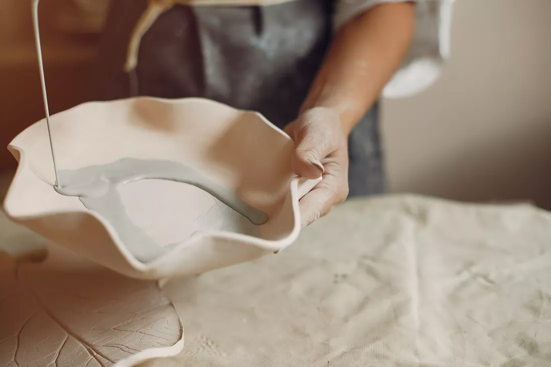 young-woman-makes-pottery-workshop