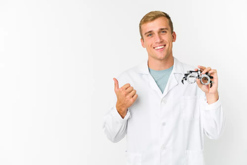 young-caucasian-optical-man-isolated-white-wall-smiling-raising-thumb-up