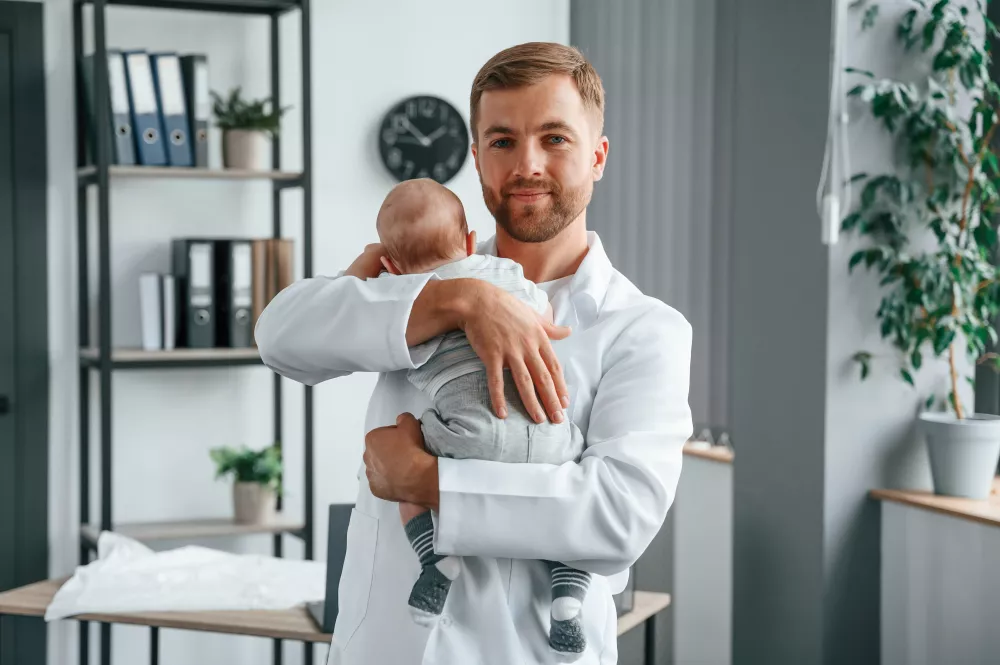 doctor-white-coat-is-taking-care-little-toddler-indoors