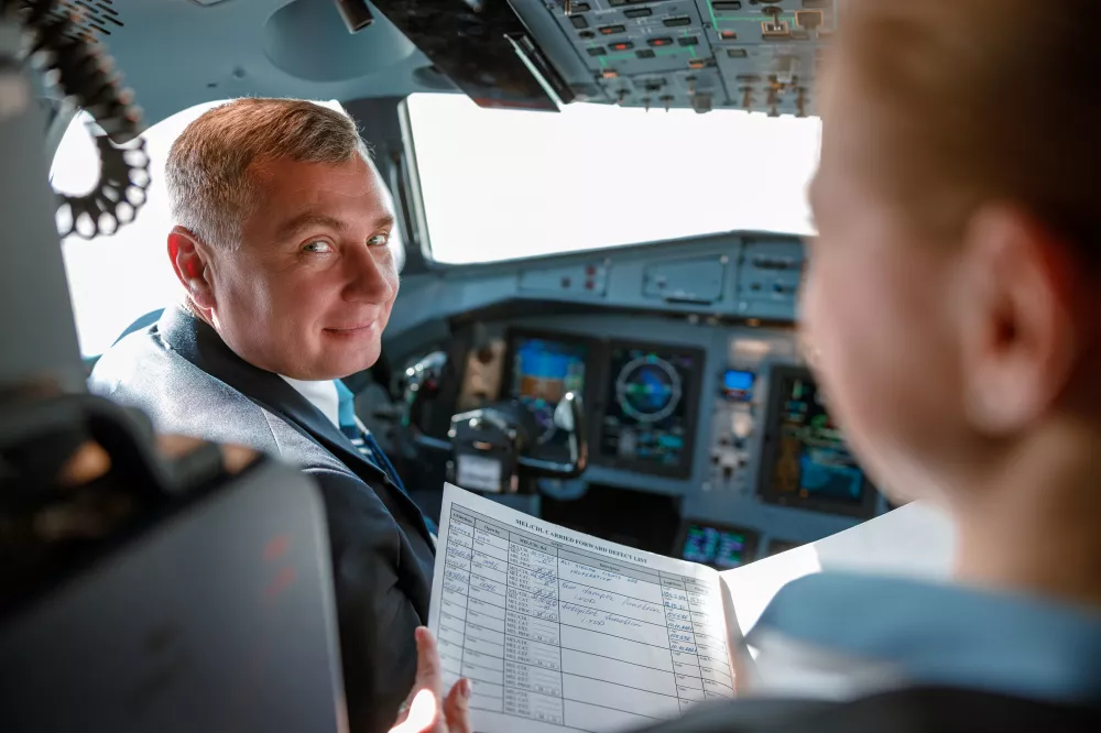 aircraft-pilot-talking-with-stewardess-cockpit