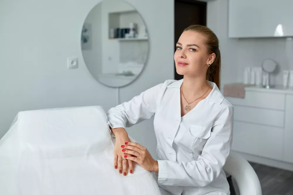 consultation-cosmetology-clinic-female-beauty-doctor-white-coat-black-gloves-crossed-hands