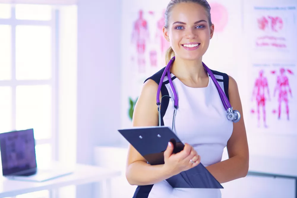 portrait-friendly-female-doctor-with-stethoscope-tablet-hands