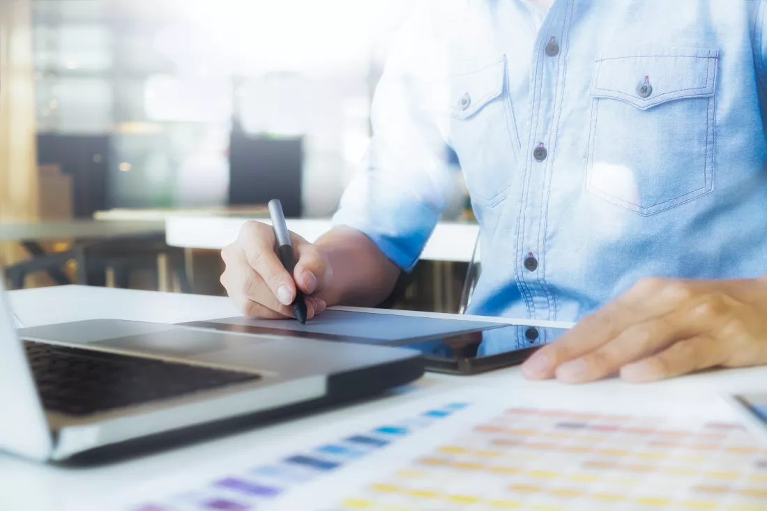artist-drawing-graphic-tablet-with-color-swatches-office-architectural-drawing-with-work-tools-accessories