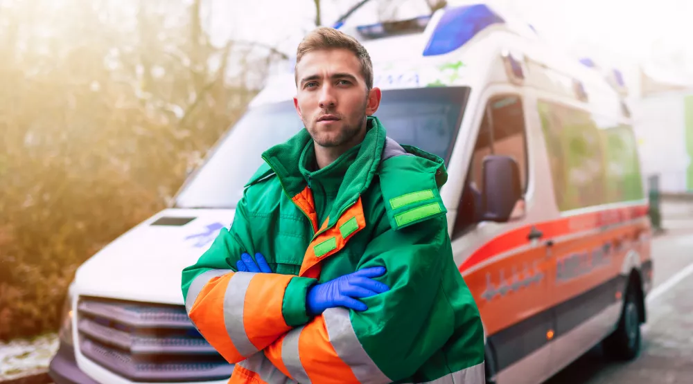 professional-confident-young-man-doctor-with-ambulance