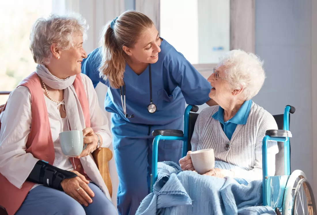 nursing-home-care-nurse-with-senior-women-doing-healthcare-checkup-examination-consultation-medical-conversation-elderly-woman-wheelchair-consulting-doctor-retirement-facility